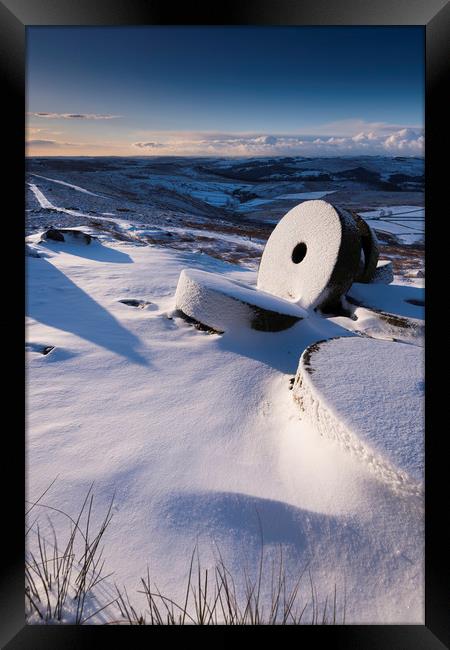 Millstones in the Snow, Derbyshire.  Framed Print by John Finney