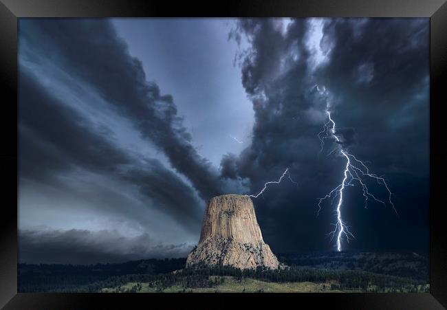 Storm over The Devils Tower Framed Print by John Finney