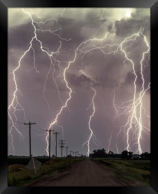 Lightning storm over Nebraska. Framed Print by John Finney
