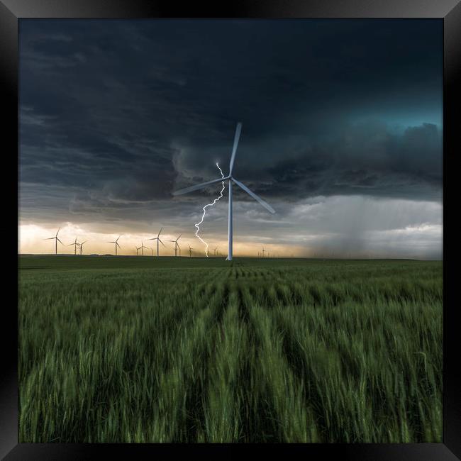 Lightning Bolt over a wind farm  Framed Print by John Finney