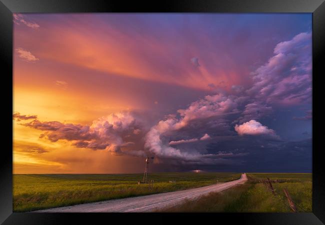 Thunderstorm sunset over Montana Framed Print by John Finney