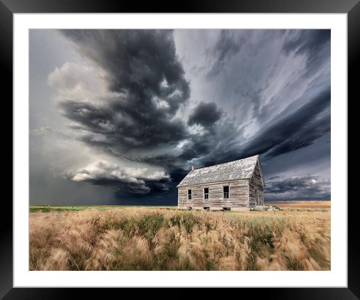 Abandoned Schoolhouse with a Storm, Colorado Framed Mounted Print by John Finney