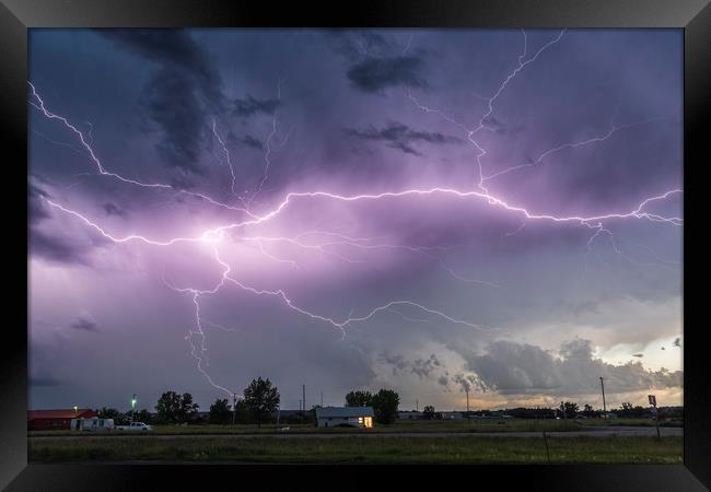 Forked Lightning Over a Montana Post Office, USA.  Framed Print by John Finney