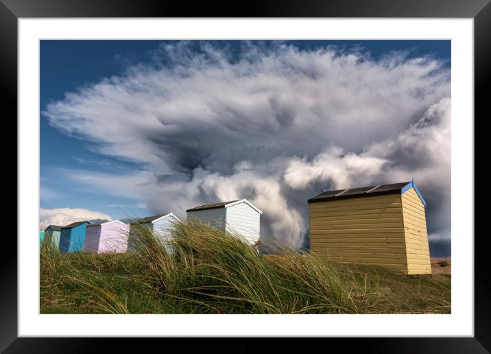 Kent Beach Huts with storm clouds Framed Mounted Print by John Finney