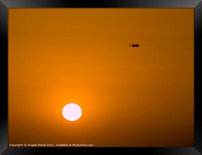 Airplane Crossing the Skies at Sunset Framed Print by Angelo DeVal