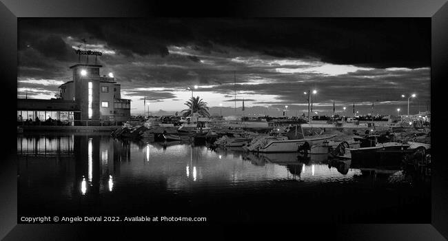 Boats in a Cloudy Twilight at Faro Marina Framed Print by Angelo DeVal