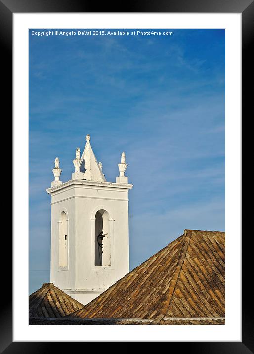 Church bell tower behind tiled roofs in Tavira  Framed Mounted Print by Angelo DeVal