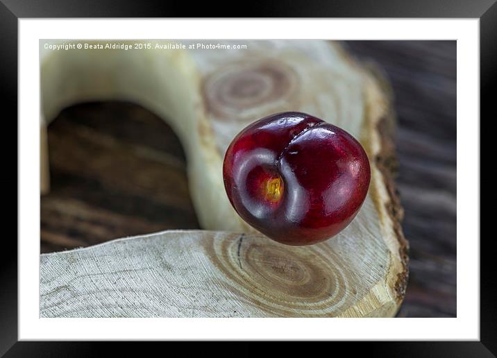  Floating cherry Framed Mounted Print by Beata Aldridge