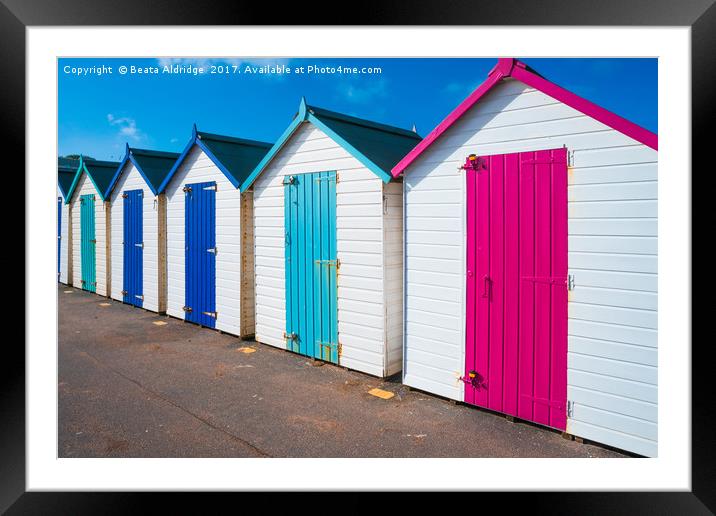 Colorful wooden beach huts Framed Mounted Print by Beata Aldridge