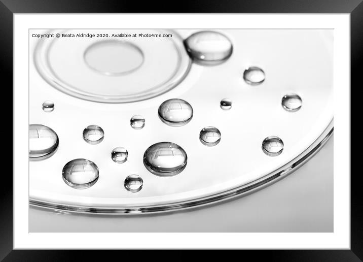 CD with water droplets Framed Mounted Print by Beata Aldridge