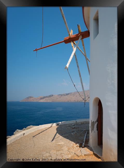 Tilted Windmill Framed Print by John Ealing