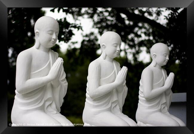 Praying Buddhist Statues  Framed Print by Jacqui Farrell