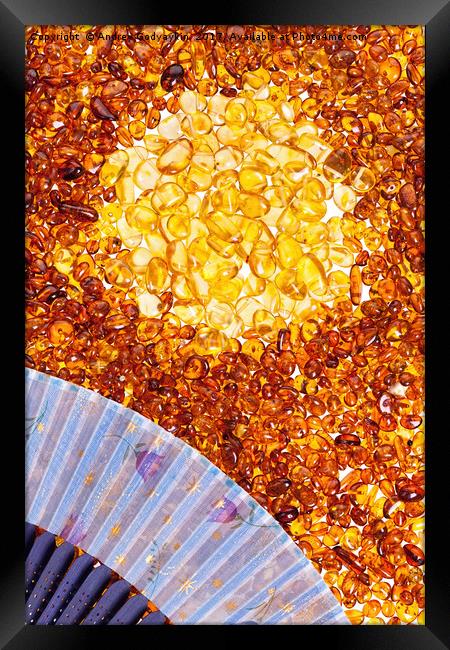 Stones of yellow amber and a blue fan. Framed Print by Andrey  Godyaykin