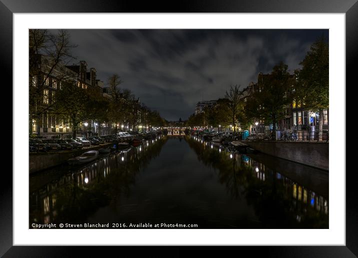 Amsterdam central canal at night  Framed Mounted Print by Steven Blanchard