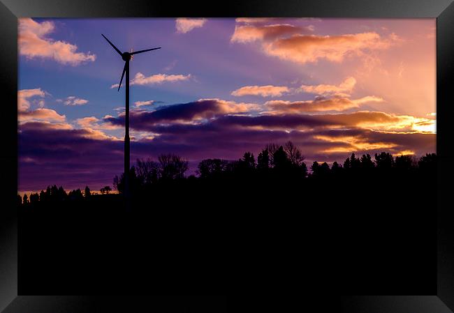small wind turbine in silhouette at sunrise Framed Print by craig baggaley