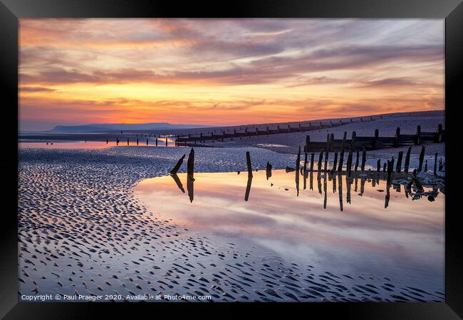 Sunset reflections at low tide Framed Print by Paul Praeger