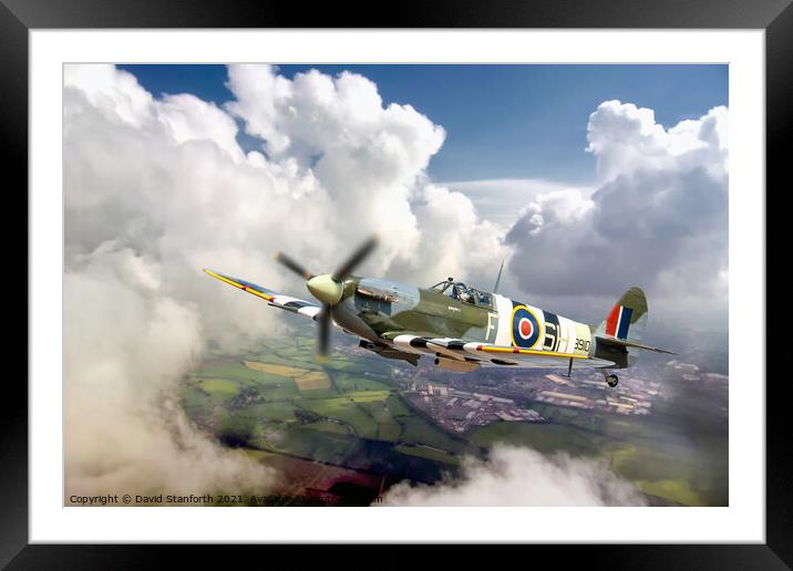 Spitfire breaks through the clouds Framed Mounted Print by David Stanforth