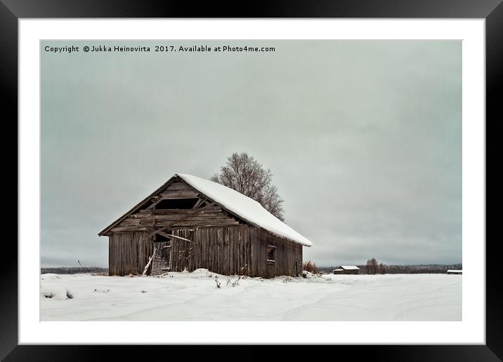 Barns On The Snowy Fields Framed Mounted Print by Jukka Heinovirta
