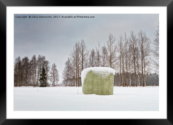 Green Roll Bale Covered With Snow Framed Mounted Print by Jukka Heinovirta