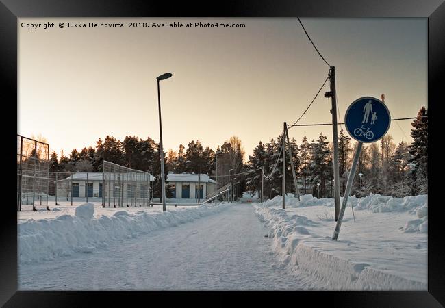 Snowy Path to the Town Framed Print by Jukka Heinovirta