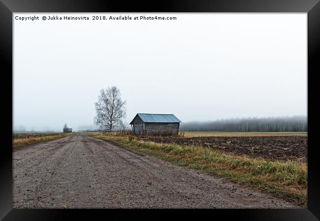 Bare Tree by a Barn House Framed Print by Jukka Heinovirta