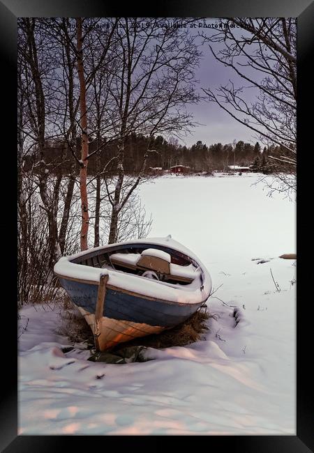 Fishing Boat Under Snow Framed Print by Jukka Heinovirta