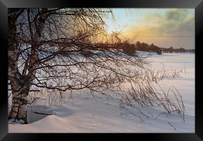 Dramatic Sunset Over The Icy River Framed Print by Jukka Heinovirta