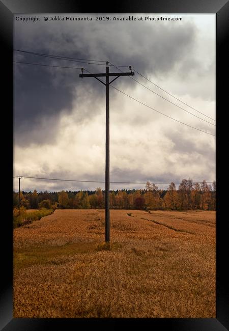 Telephone Pole Under The Heavy Clouds Framed Print by Jukka Heinovirta