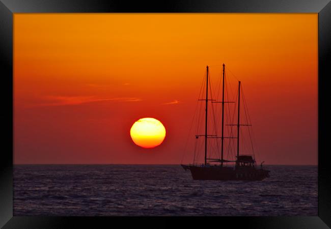 Masts in an Oia Sunset Framed Print by Jeremy Hayden