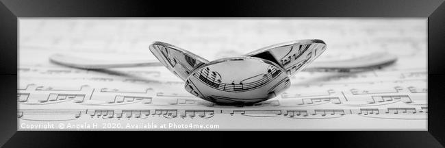 Musical Spoons Framed Print by Angela H