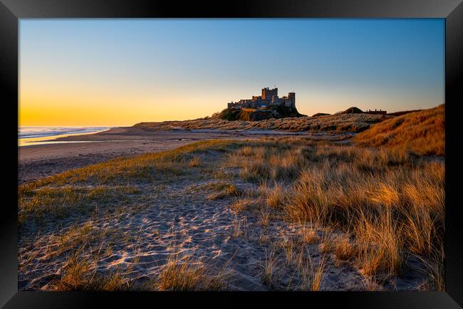 Sunrise at Bamburgh castle, Northumberland Framed Print by Michael Brookes