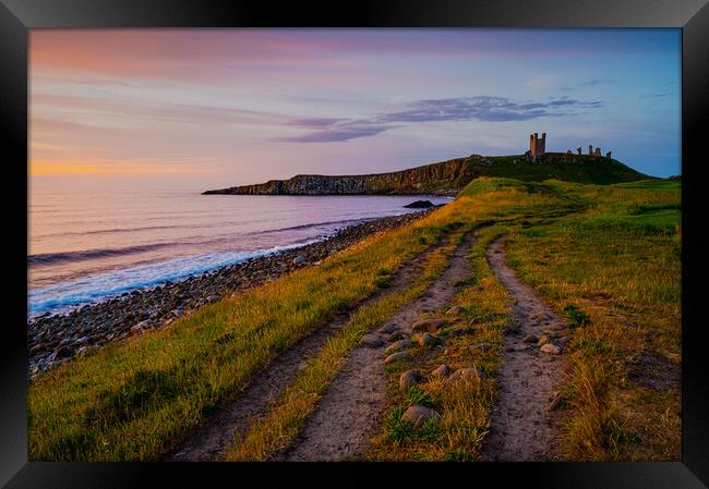 Dunstanburgh Castle at dawn Framed Print by Michael Brookes