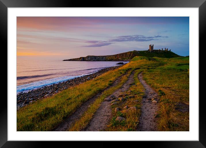 Dunstanburgh Castle at dawn Framed Mounted Print by Michael Brookes