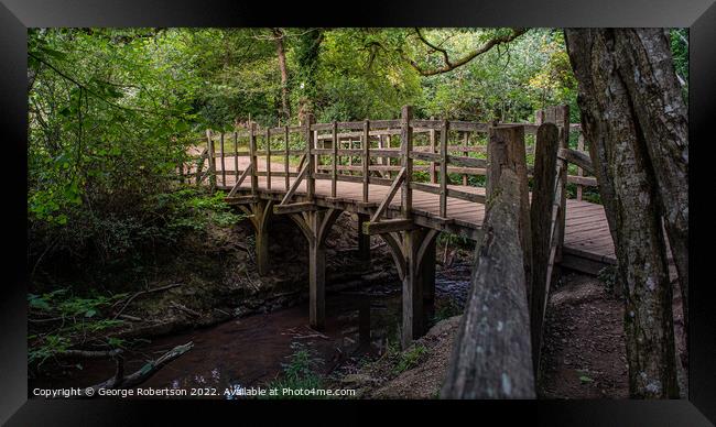 Pooh Sticks Bridge located in the One Hundred Acre woods in the stories Framed Print by George Robertson