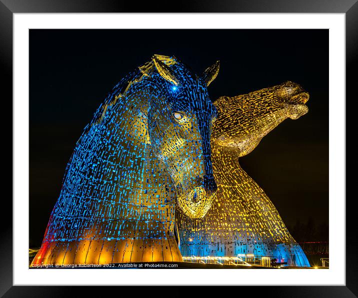 The Kelpies in support of Ukraine are light up in blue and yello Framed Mounted Print by George Robertson
