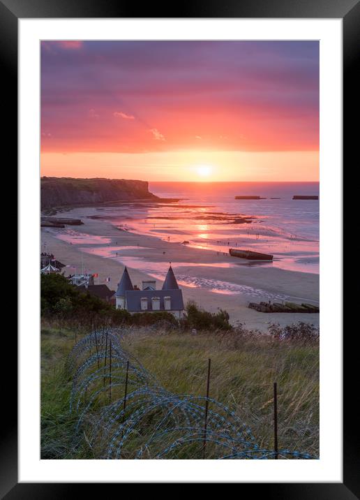 Setting sun on Mulberry Harbours at Arromanche Framed Mounted Print by George Robertson