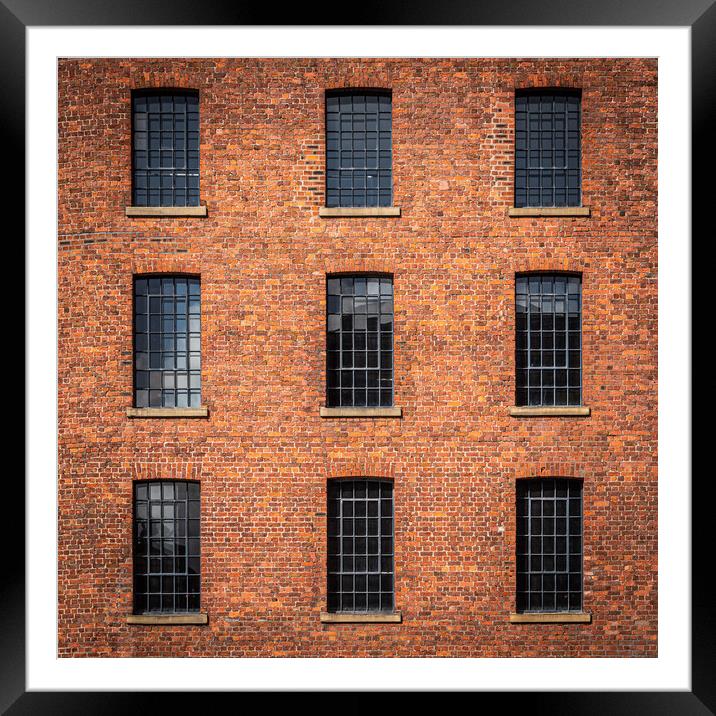 Windows in Albert dock warehouse in Liverpool , England. Framed Mounted Print by George Robertson