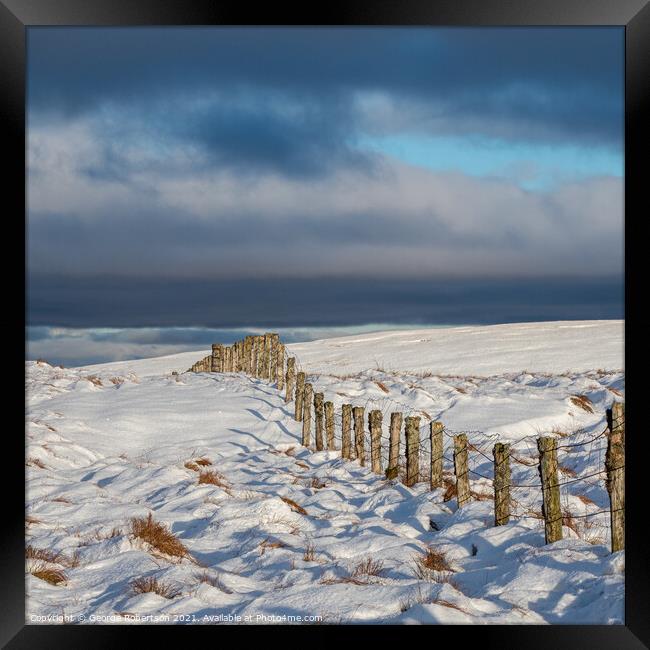 A fence line in Snow Framed Print by George Robertson