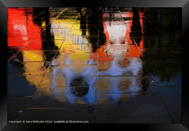 abstract reflections of shadows and neon light in wet pavement Framed Print by Sara Melhuish