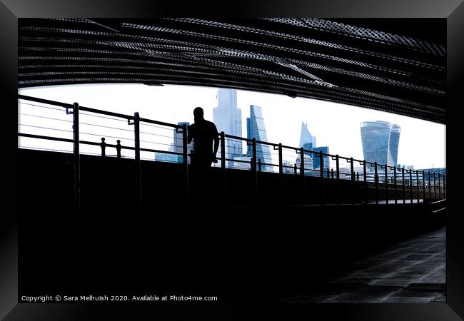 Man under the bridge Framed Print by Sara Melhuish