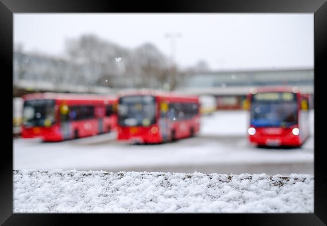 A trio of London buses in the snow Framed Print by Sara Melhuish