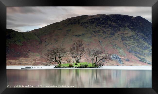 Island reflections in Crummock water  Framed Print by Russell Burton