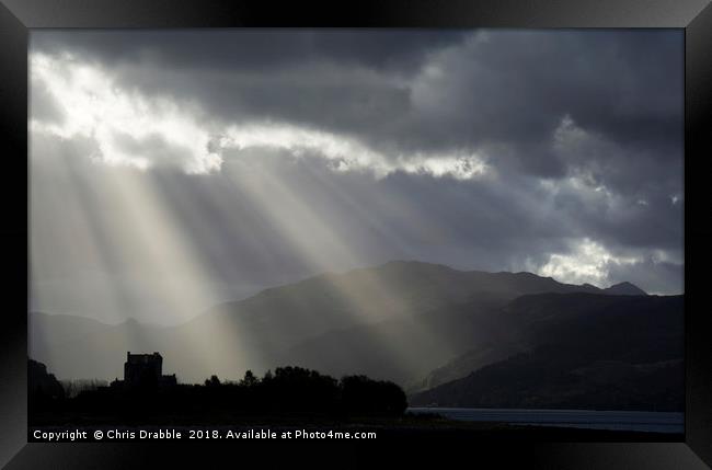 Crepuscular rays over Eilean Donan Castle Framed Print by Chris Drabble