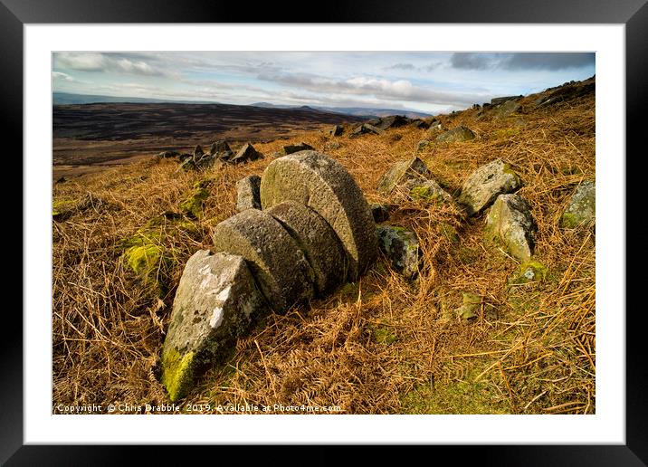 Abandoned Mill Stones under Stanage Edge. Framed Mounted Print by Chris Drabble