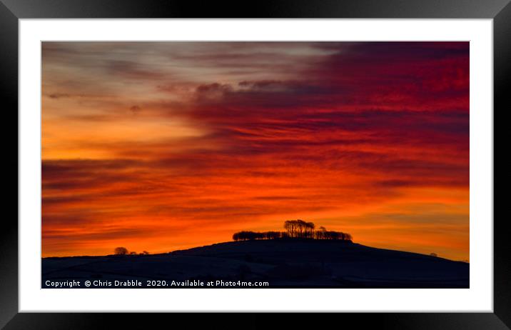 Minninglow with light from the rising sun (1) Framed Mounted Print by Chris Drabble
