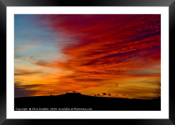 Minninglow with light from the rising sun (4) Framed Mounted Print by Chris Drabble