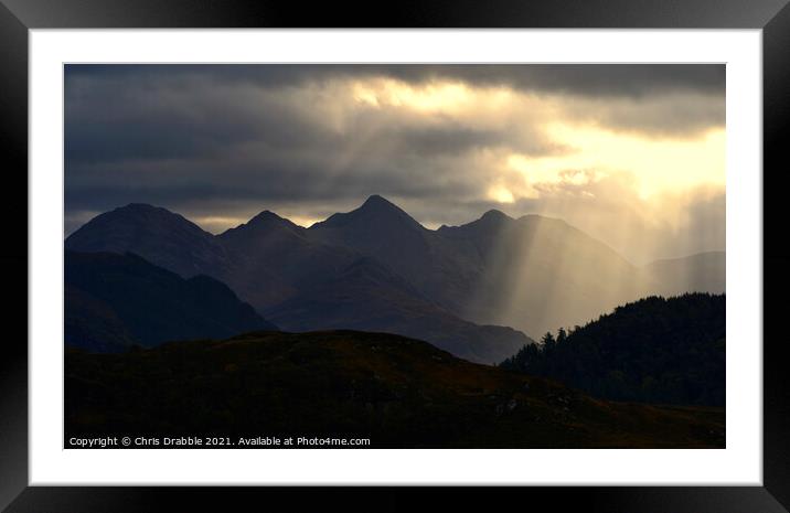 The Five Sisters of Kintail illuminated in light r Framed Mounted Print by Chris Drabble