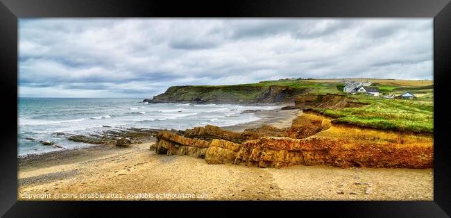 Widemouth Bay under cloudy skies Framed Print by Chris Drabble