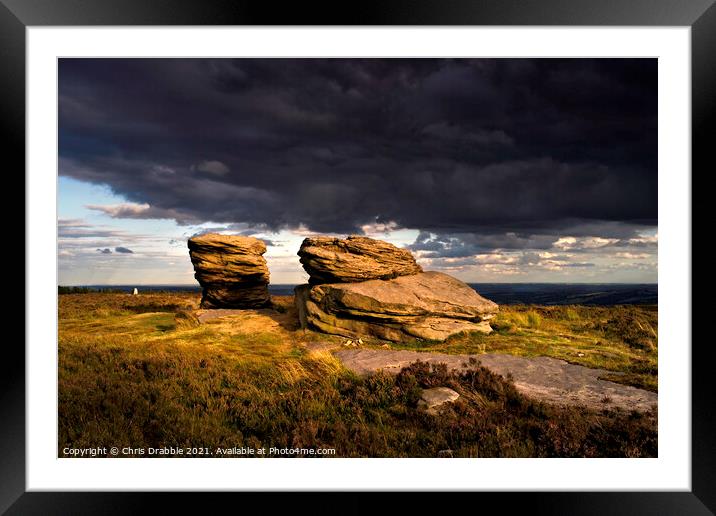 The Ox Stones caught in storm light Framed Mounted Print by Chris Drabble