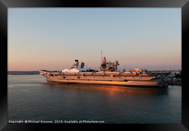 HMS Queen Elizabeth in Portsmouth at sunset Framed Print by Michael Greaves